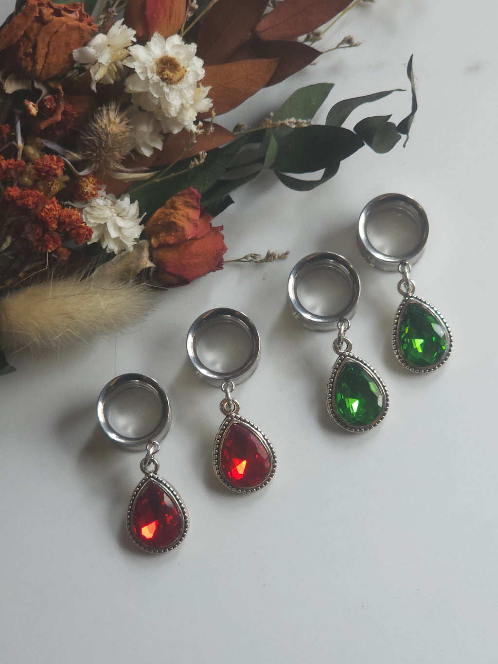 Red/Green teardrop dangle plugs dangle gauges.  Christmas
