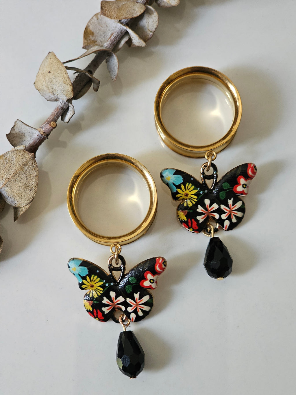 Black butterfly dangle gauges