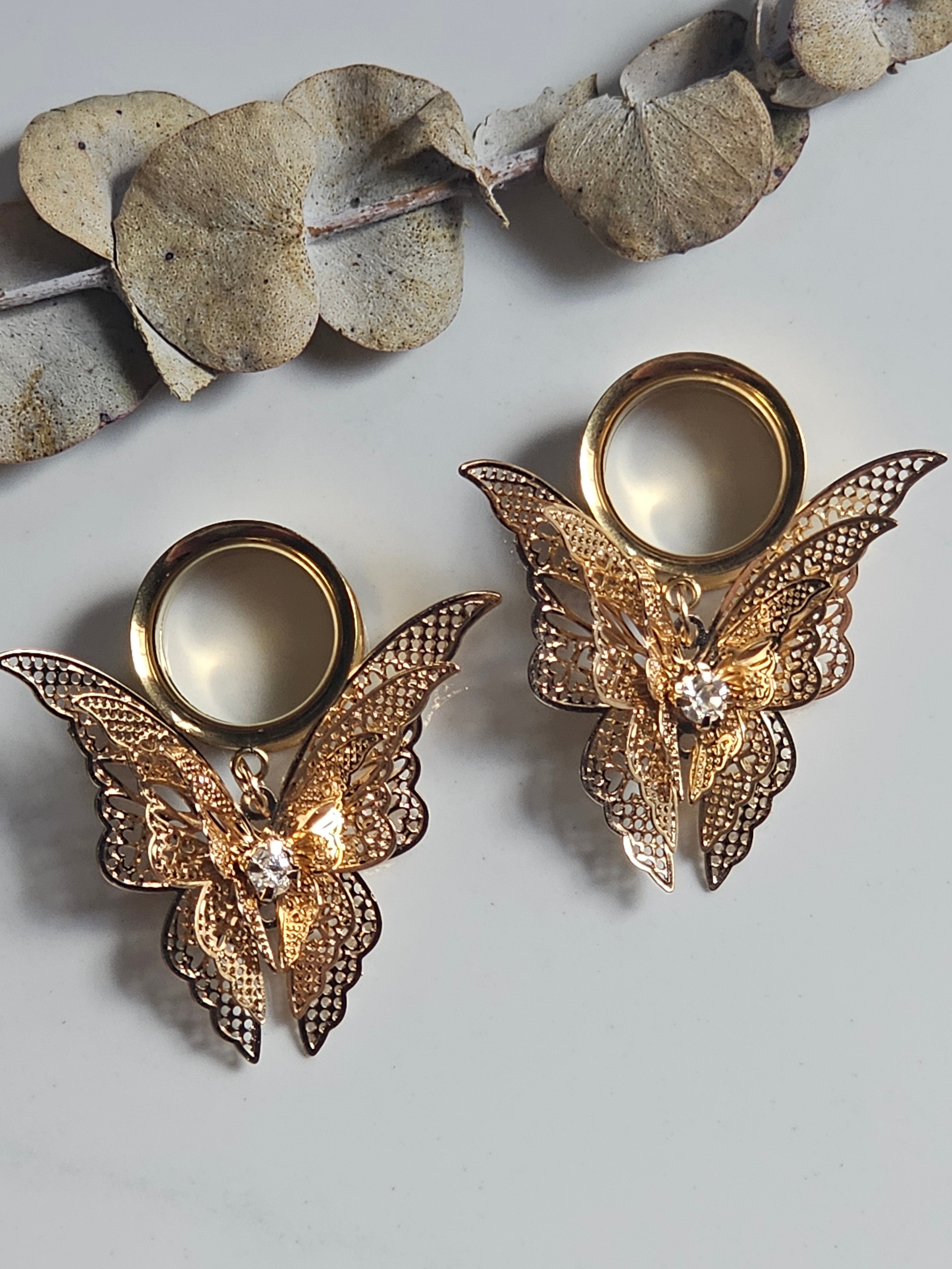 Fluttering butterfly dangle gauges