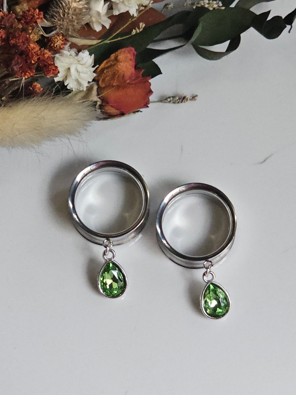 Small peridot dangle gauges