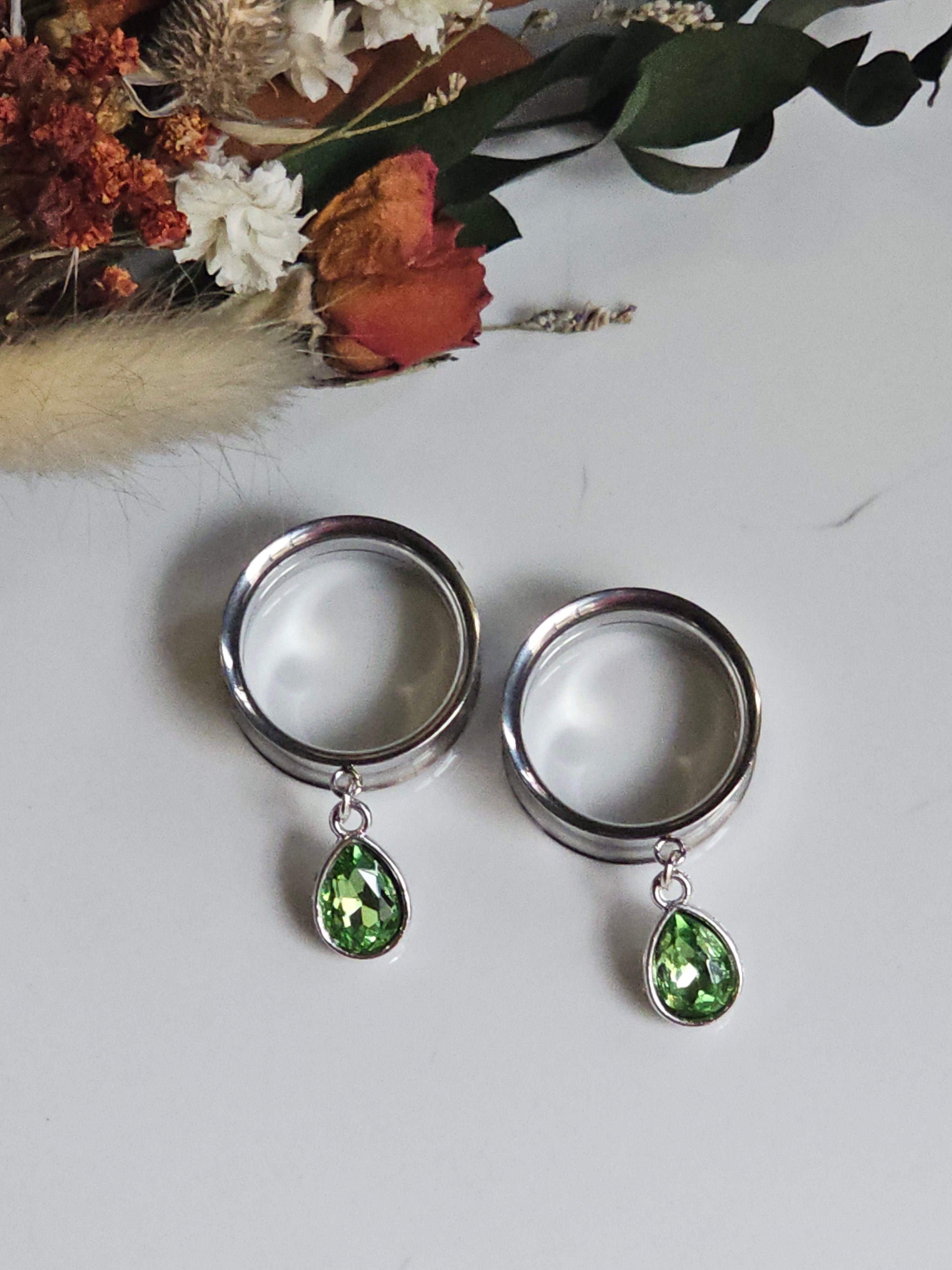 Small peridot dangle gauges