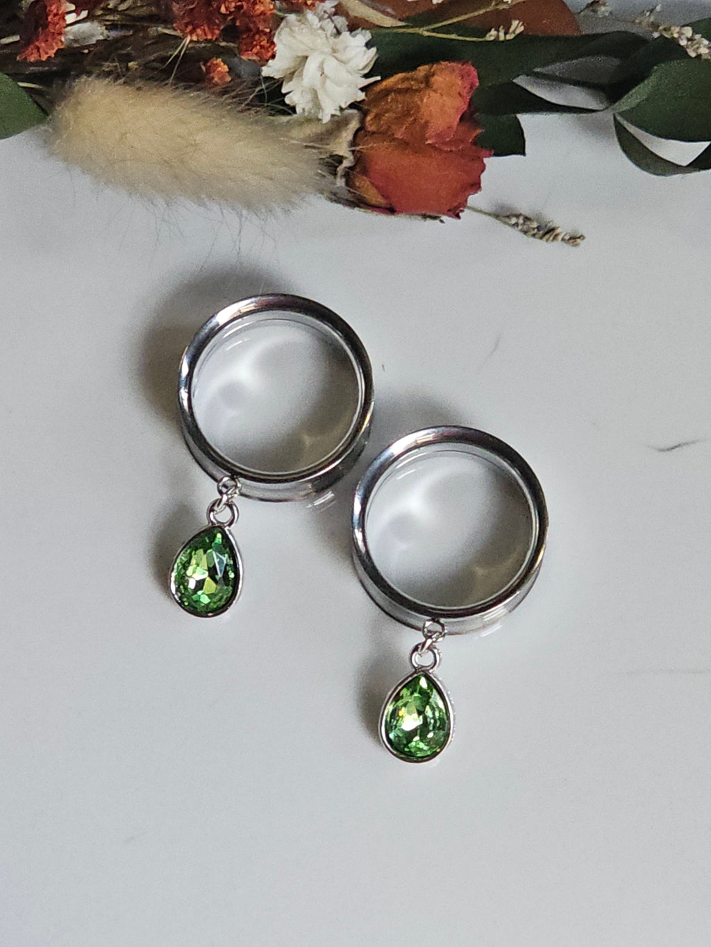 Small peridot dangle gauges