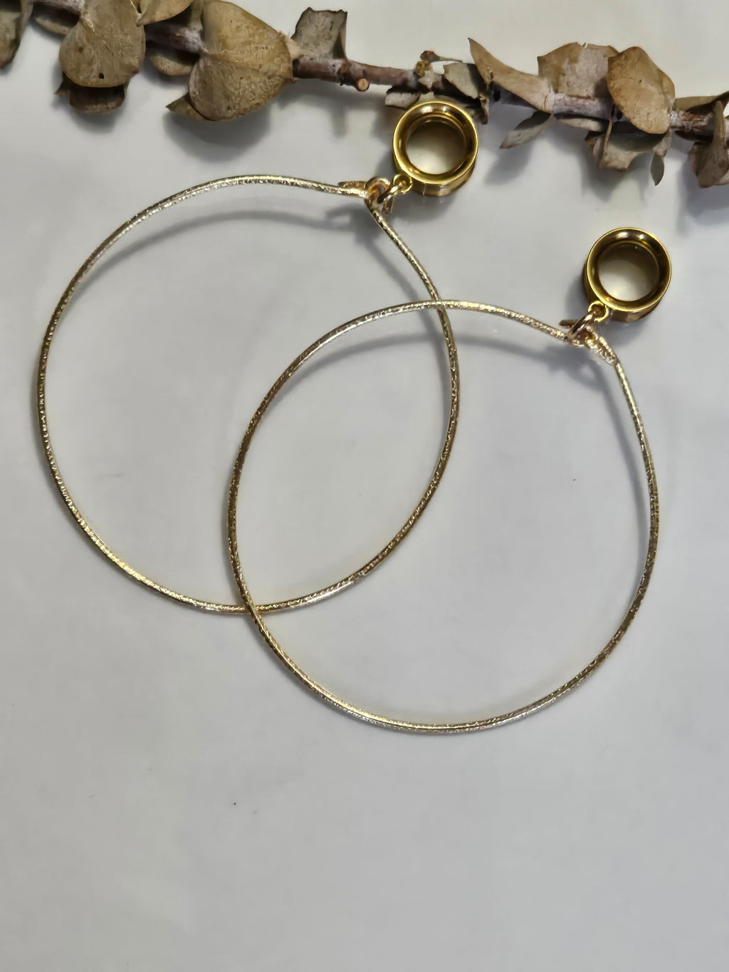 Large hoop dangle gauges