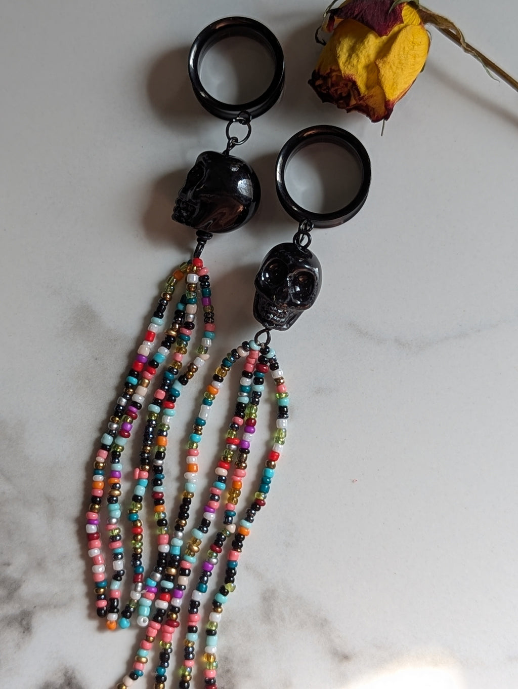 Beaded Skull tasseled dangle gauges