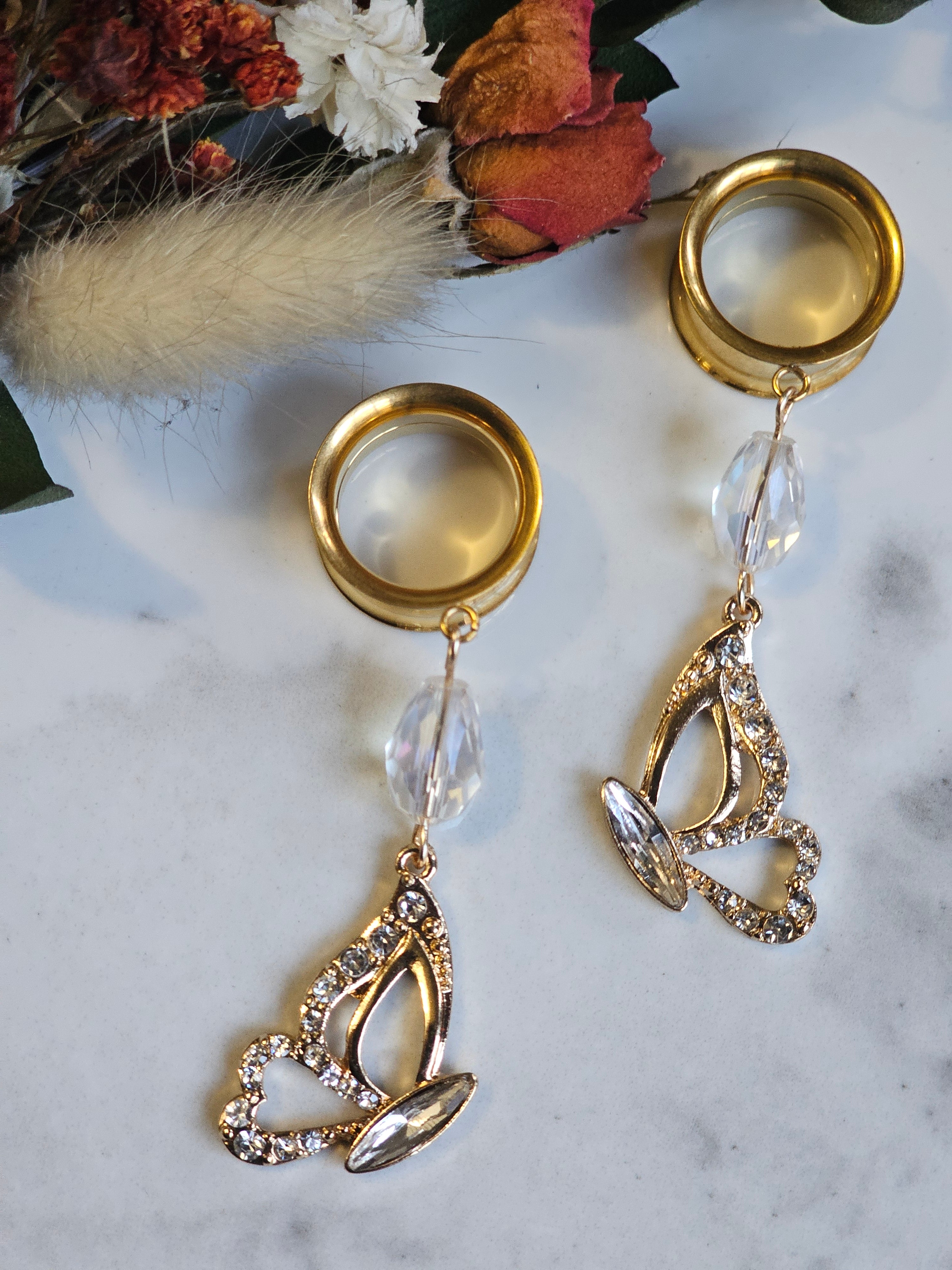 Golden butterfly dangle gauges