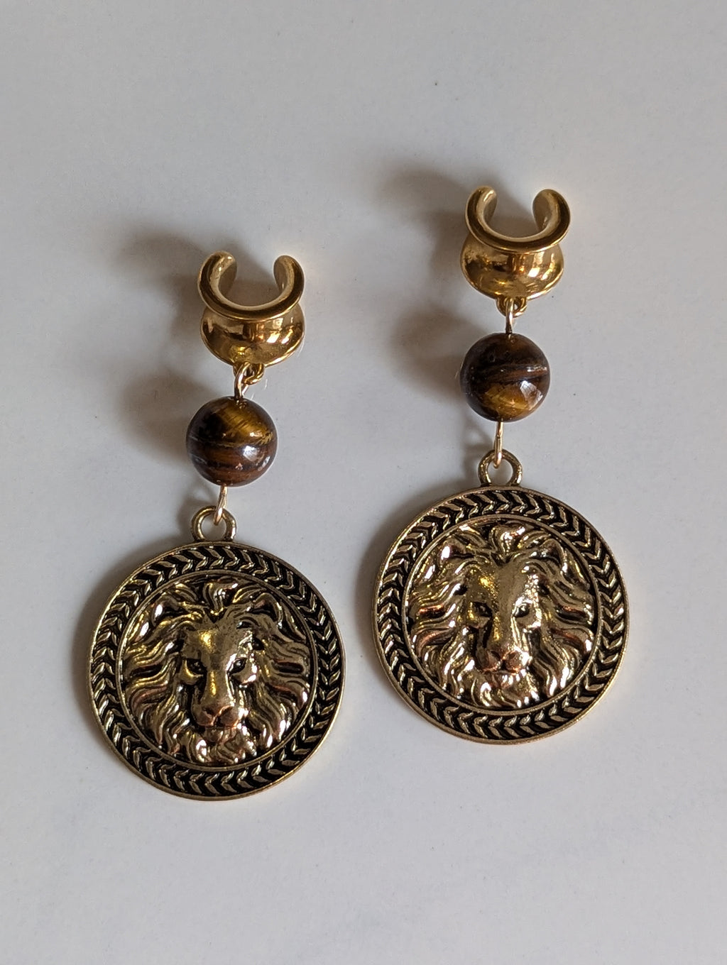 Lion Medallion saddle gauges