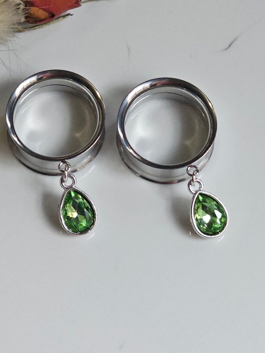 Small peridot dangle gauges