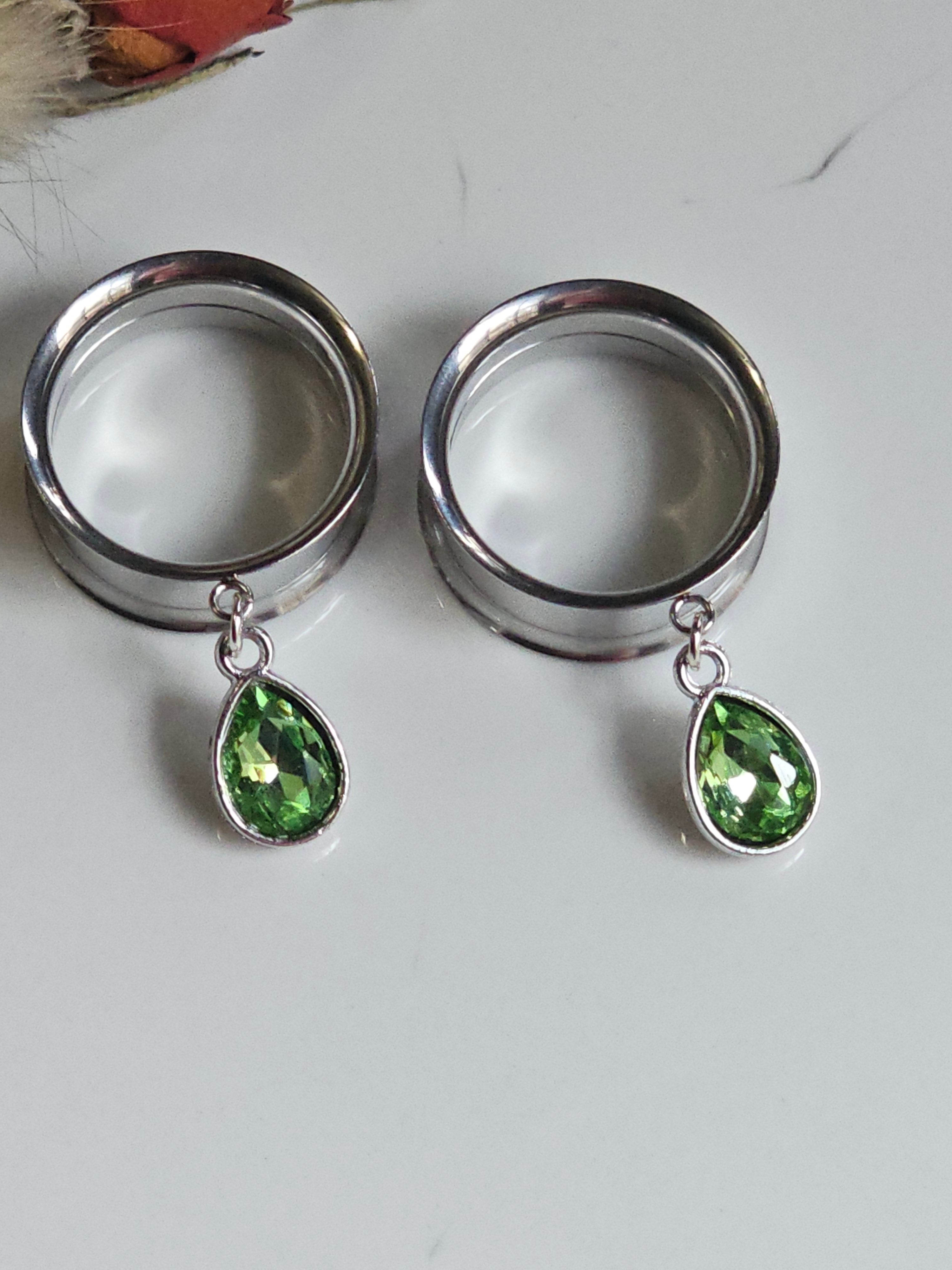 Small peridot dangle gauges