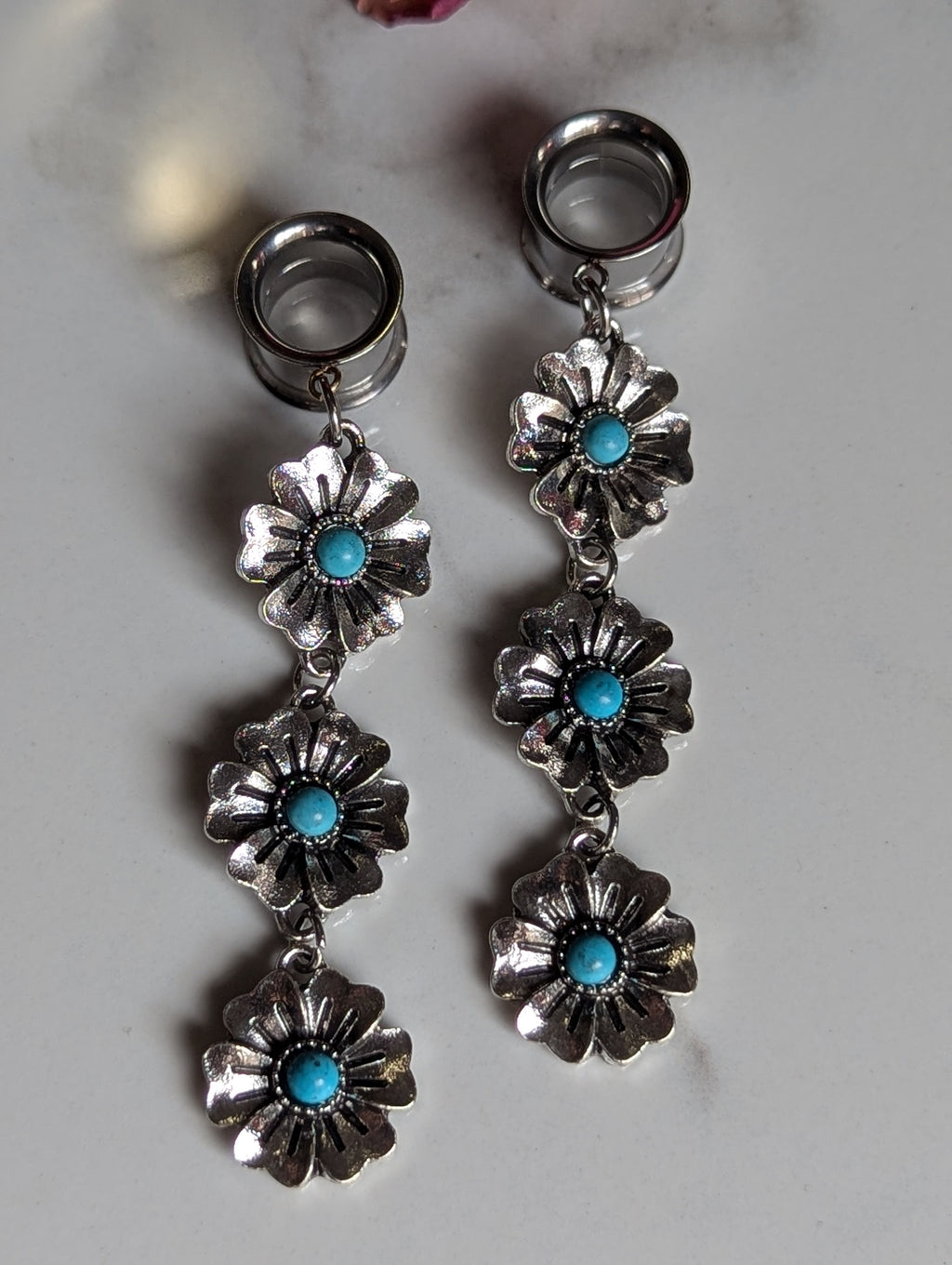 Turquoise flower dangle gauges