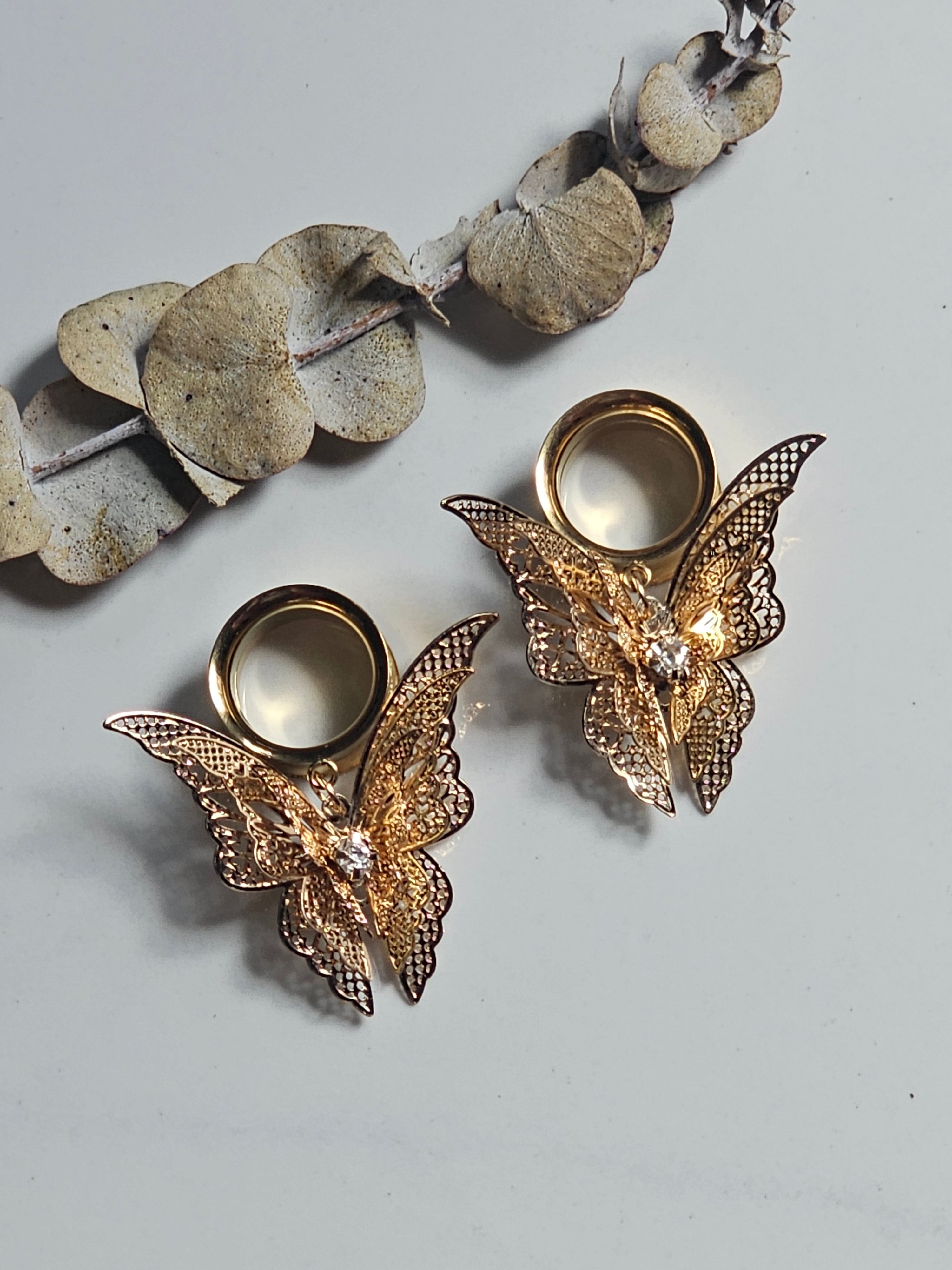 Fluttering butterfly dangle gauges