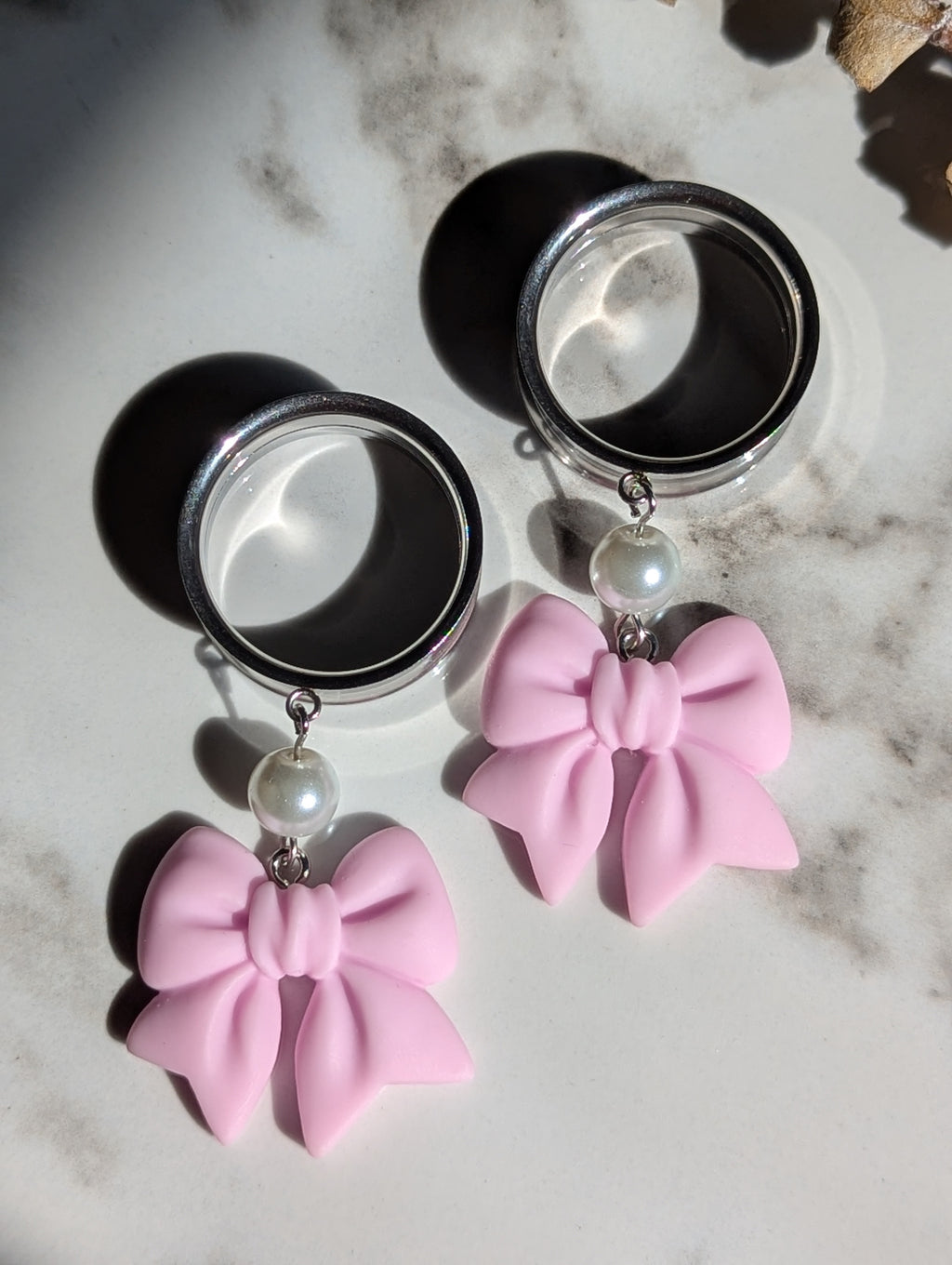 Pink bow dangle gauges