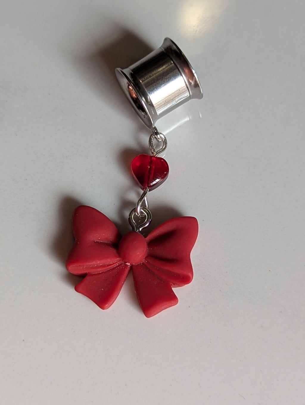 Red bow dangle gauges