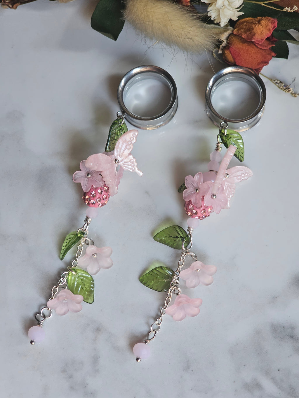 Pink floral dangle gauges