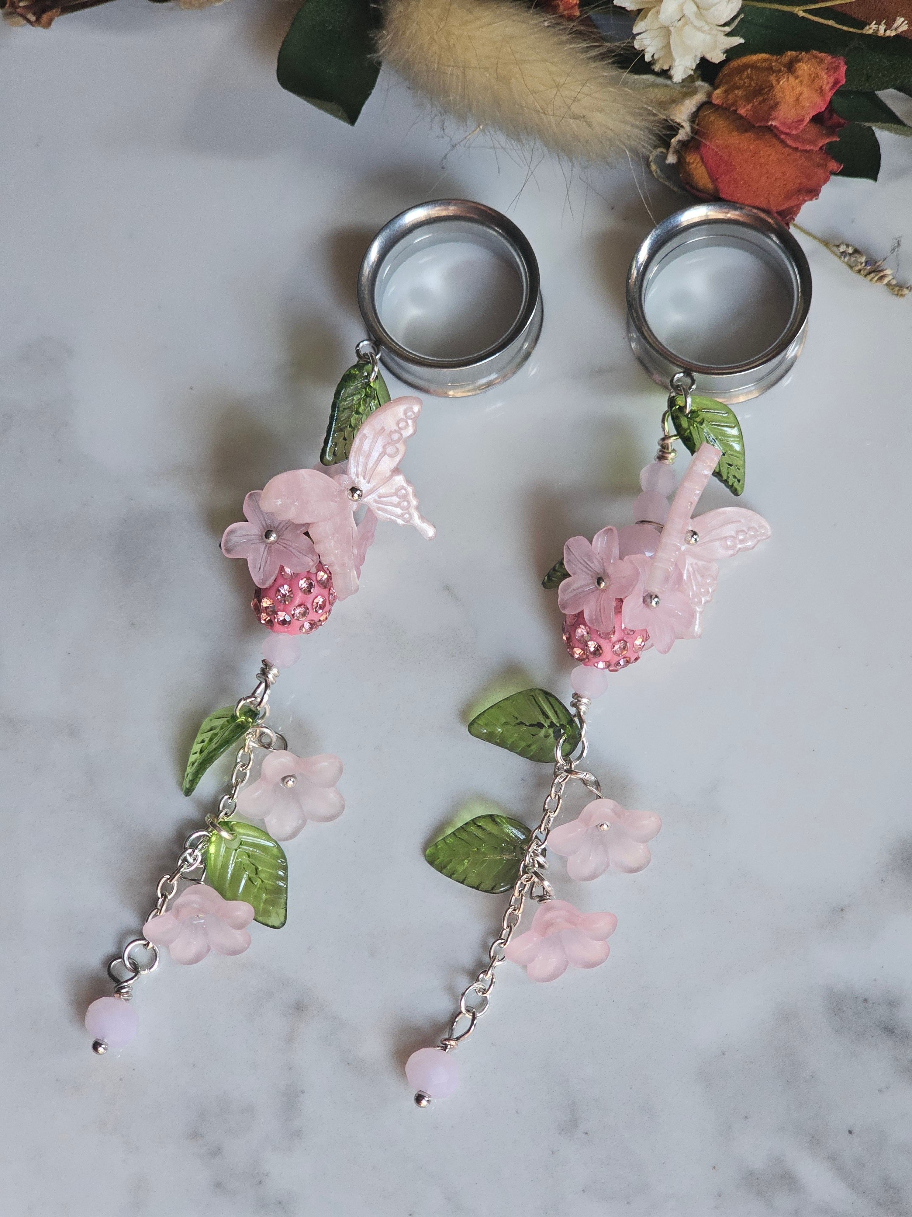 Pink floral dangle gauges