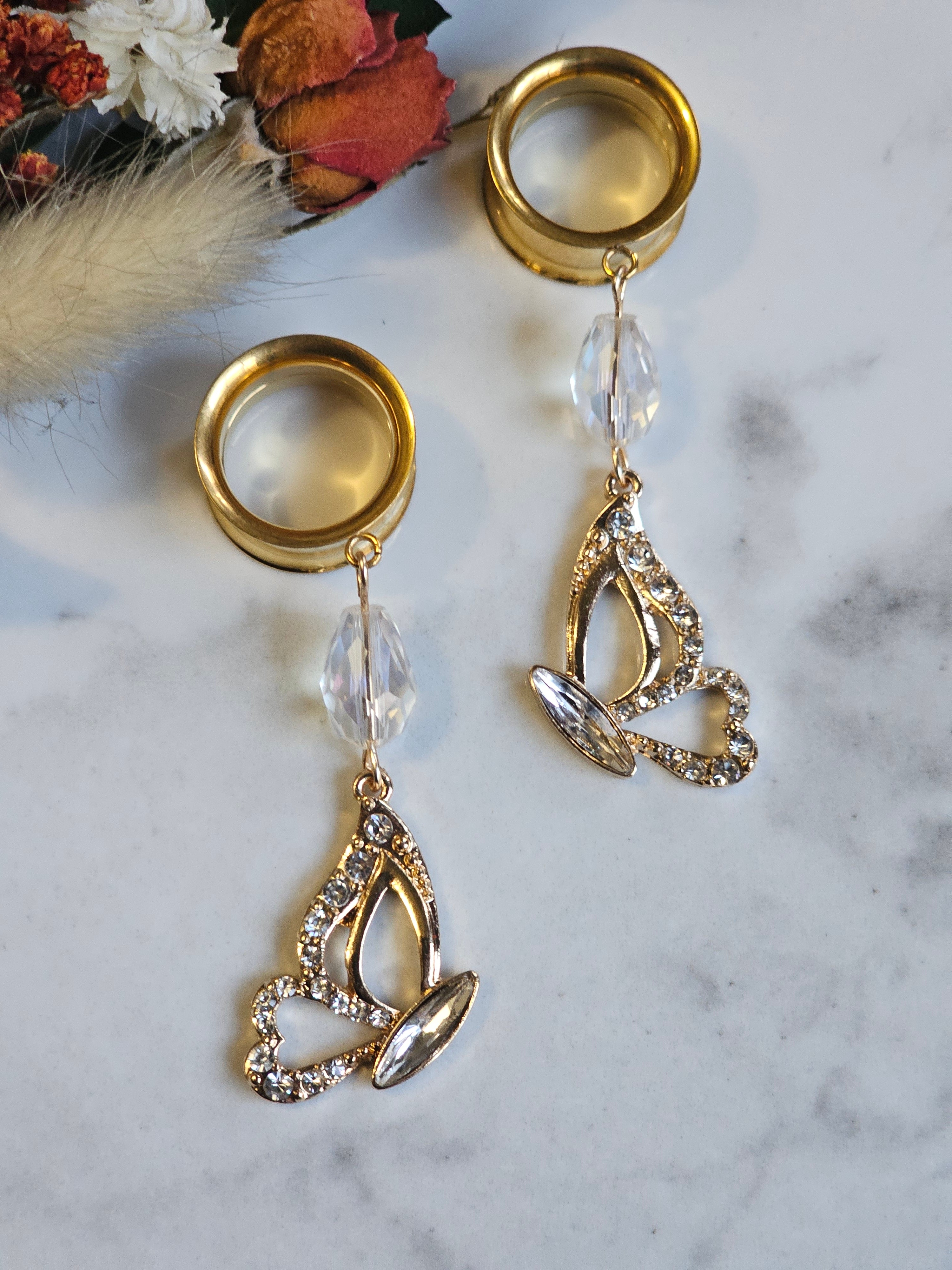 Golden butterfly dangle gauges