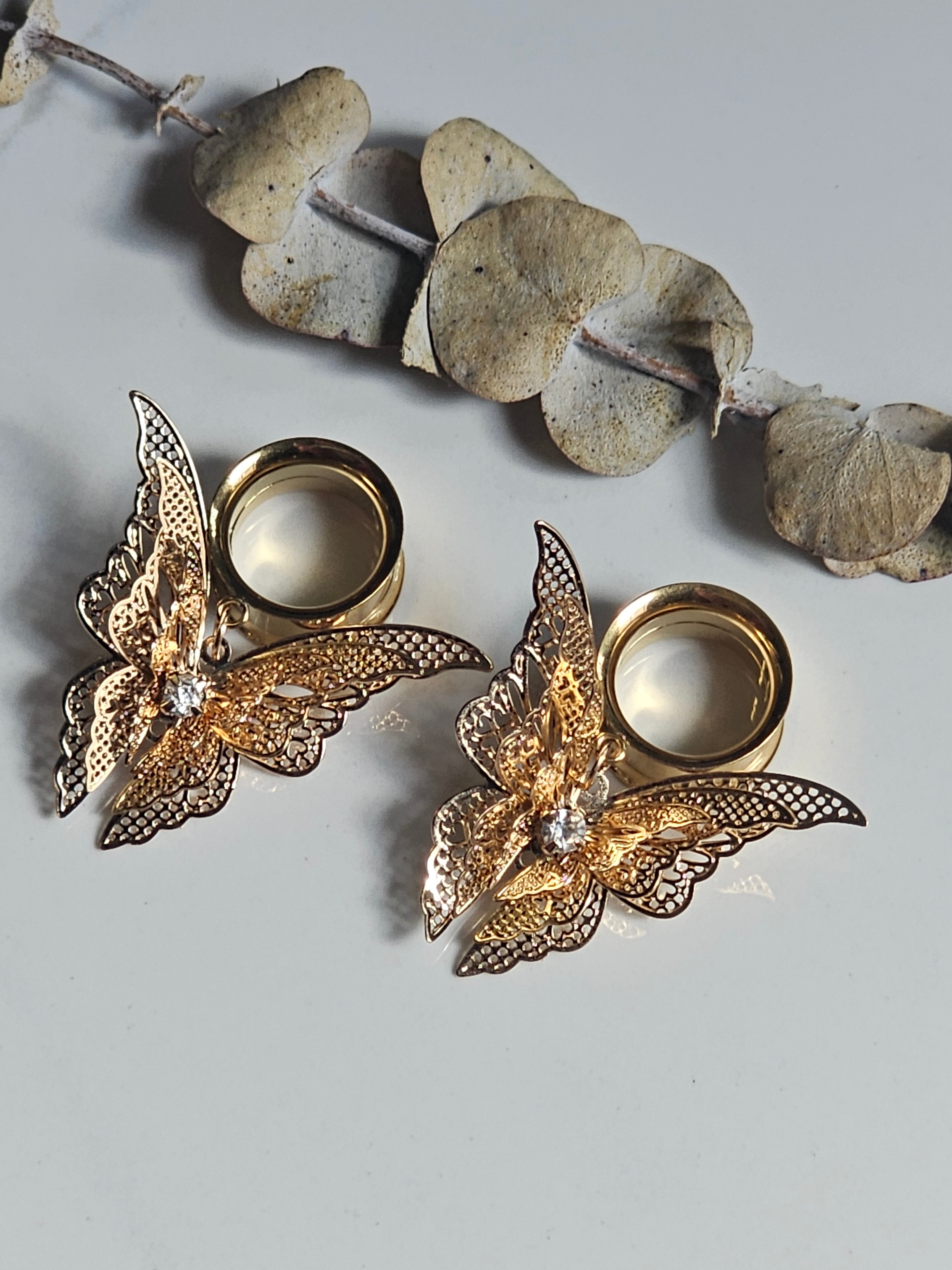 Fluttering butterfly dangle gauges