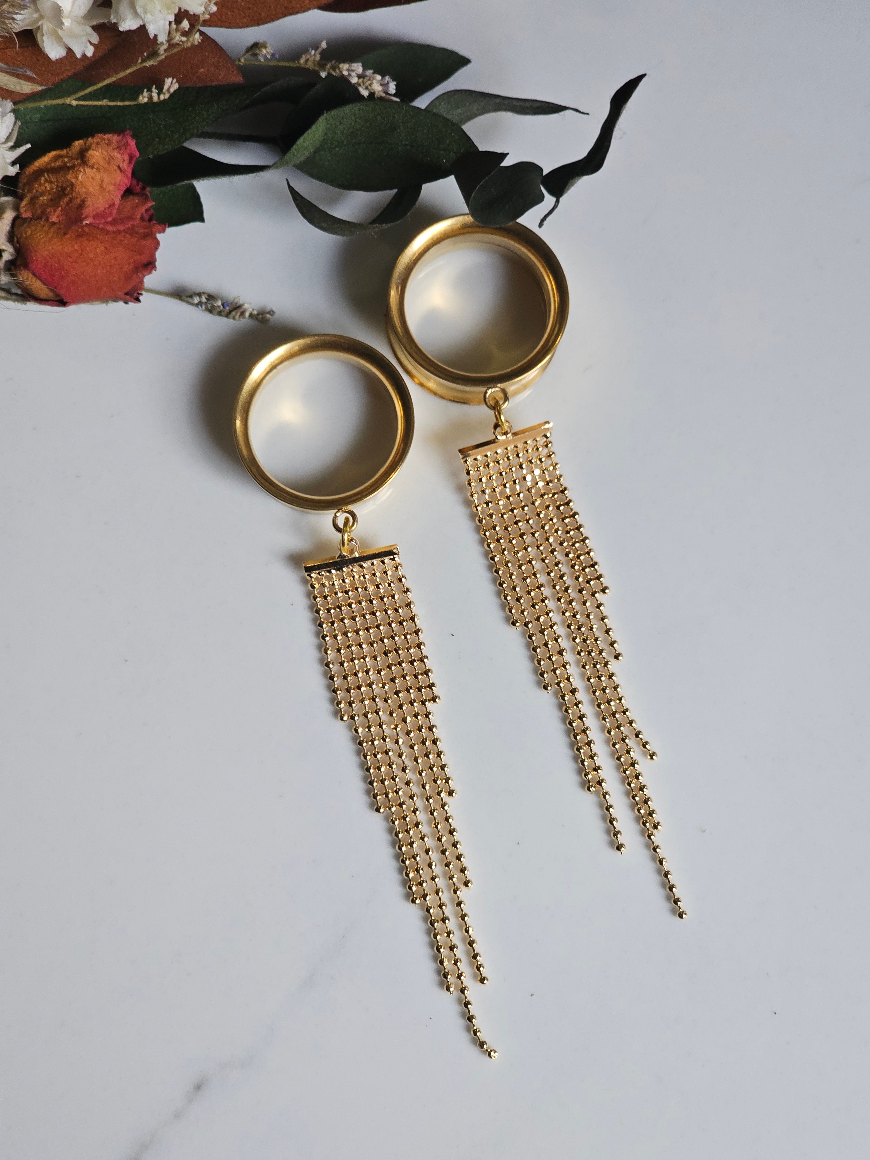 Golden tassel dangle gauges