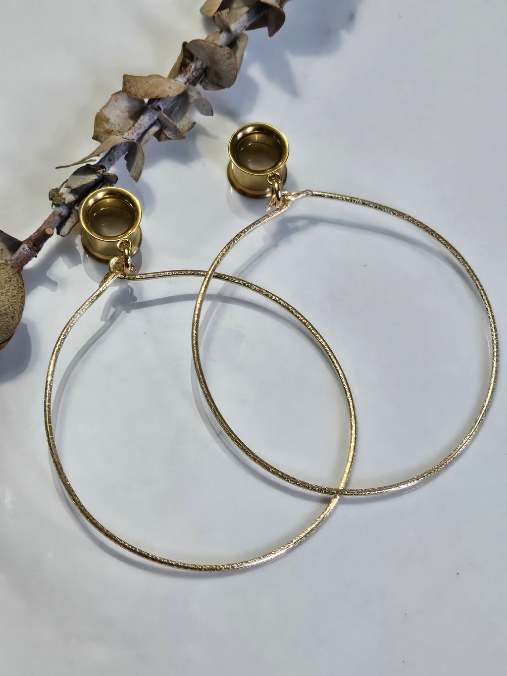 Large hoop dangle gauges