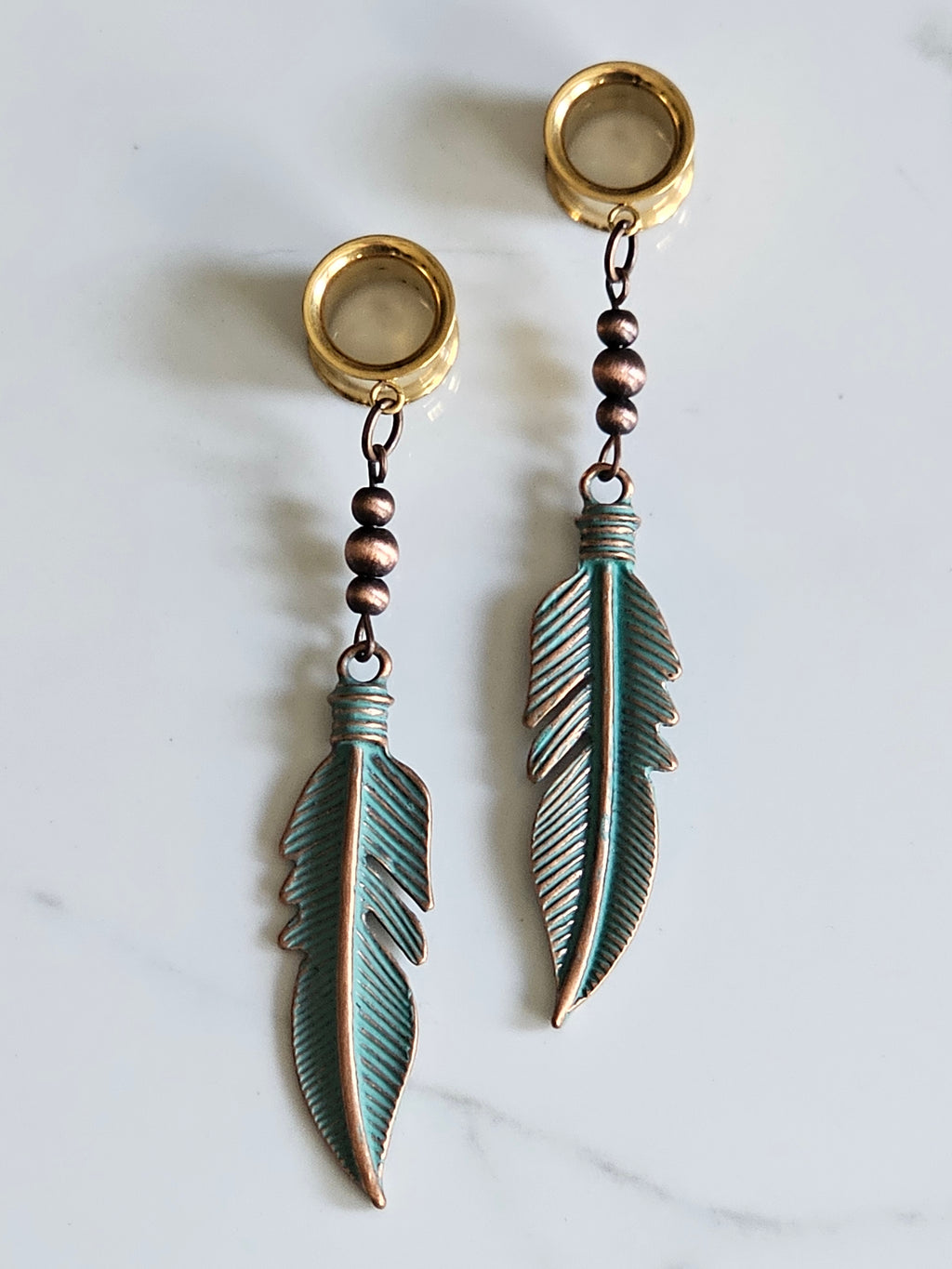 Antique style feather dangle gauges