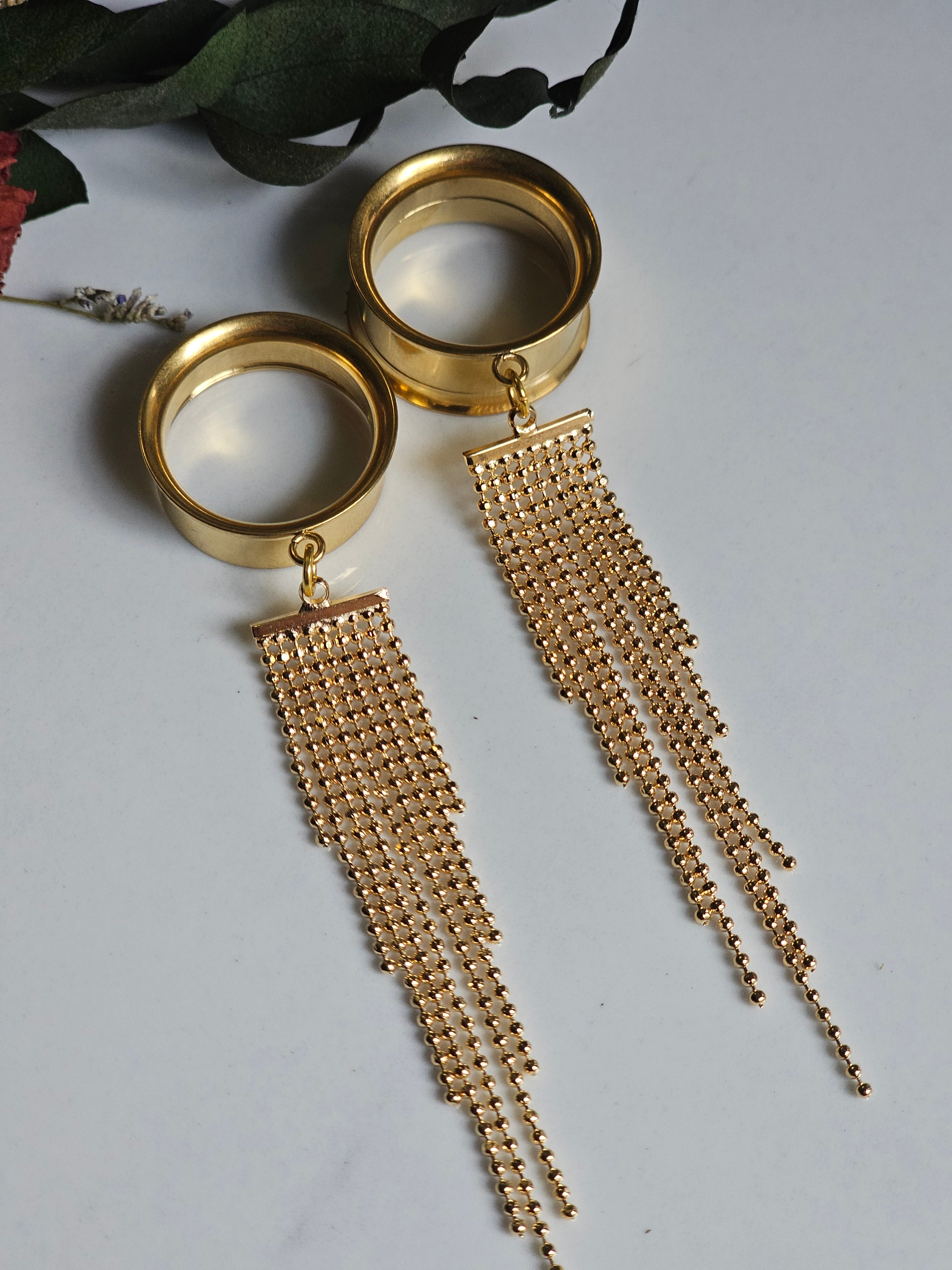 Golden tassel dangle gauges