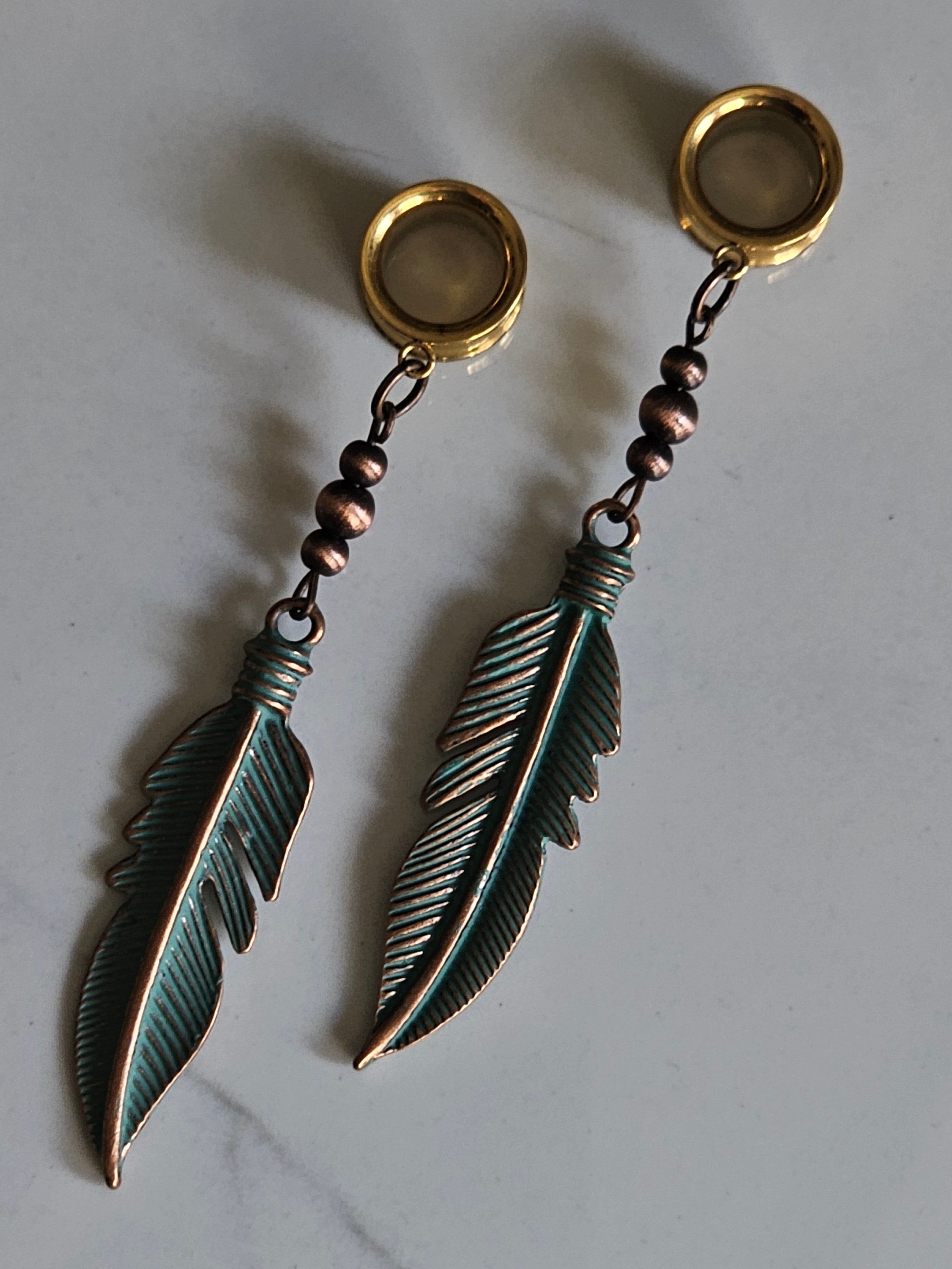 Antique style feather dangle gauges