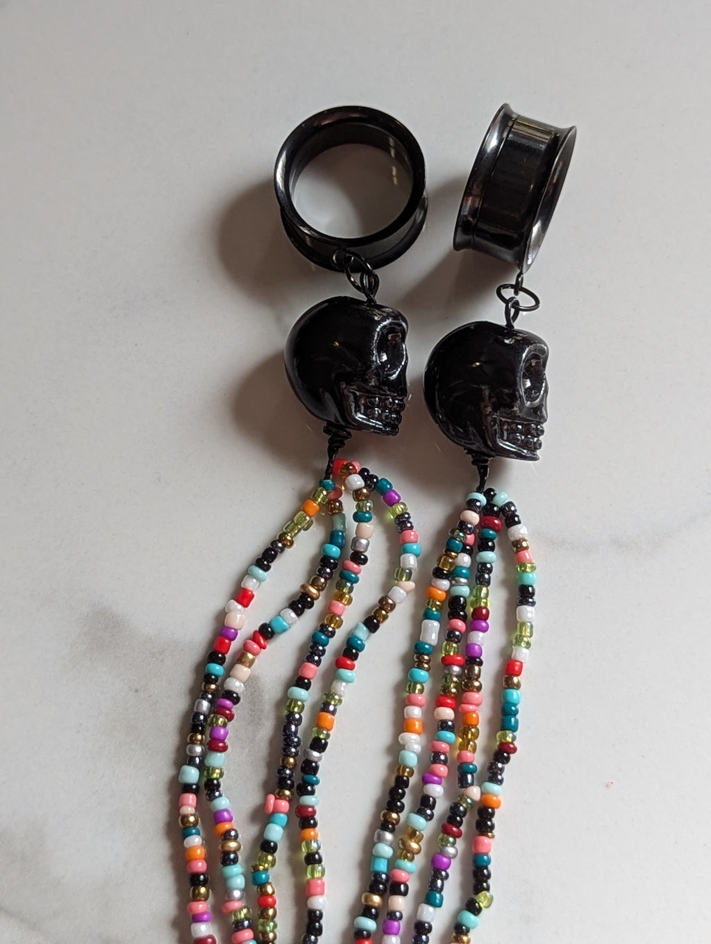 Beaded Skull tasseled dangle gauges