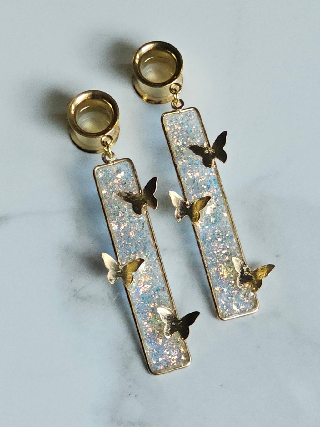 Butterfly dangle gauges